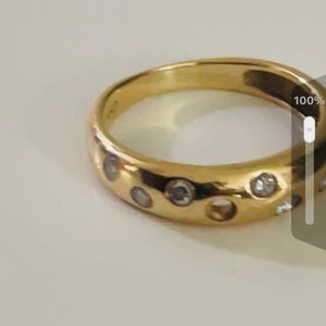 14 karat gold ring with 9 diamonds